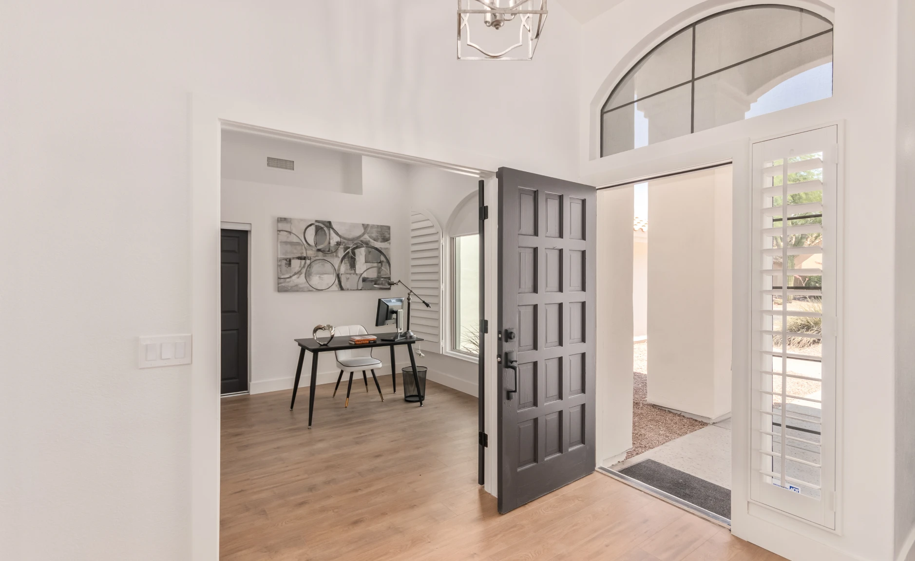 Home office with large window and desk